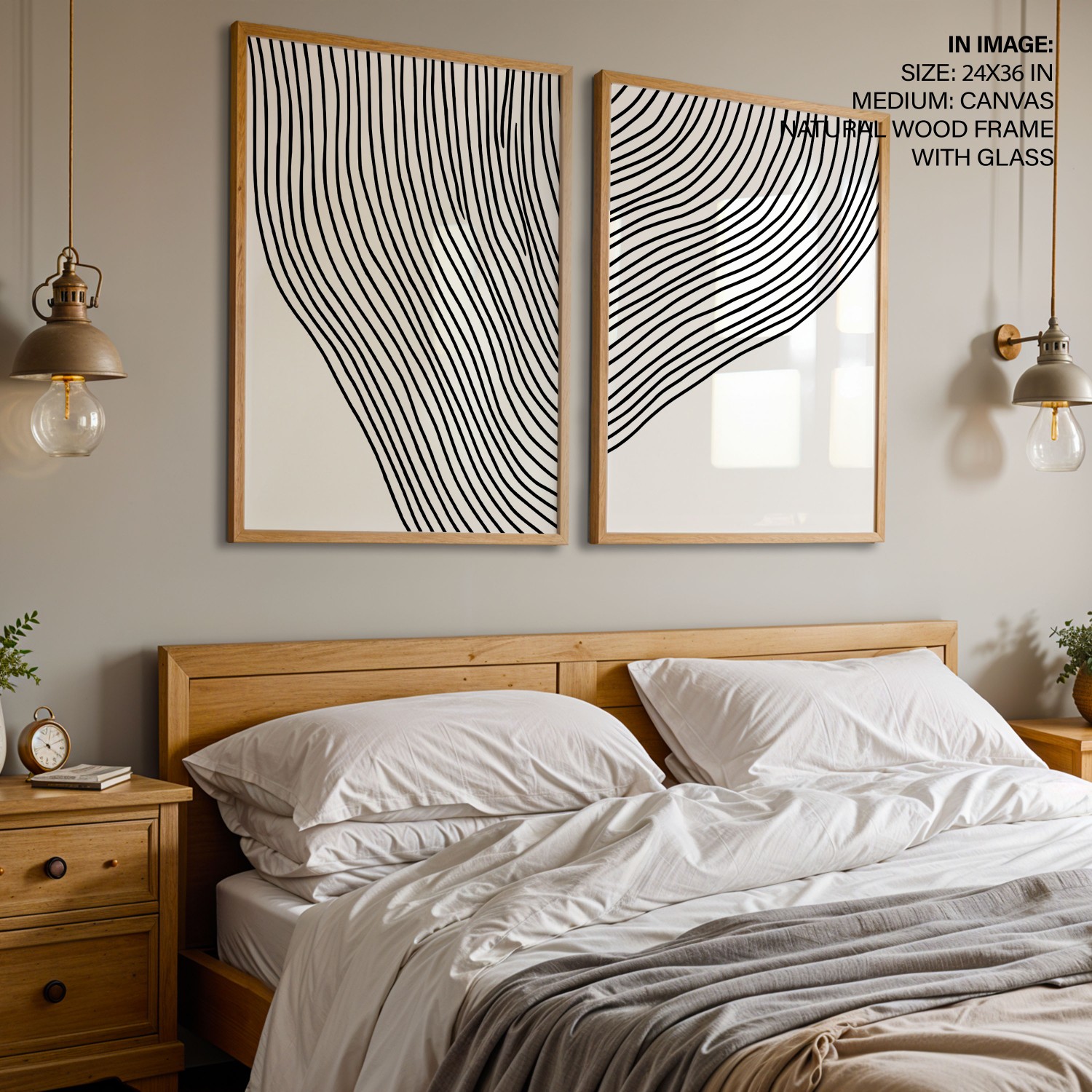 A pair of black-and-white line-art prints above a wooden bed, low in contrast against a pale wall