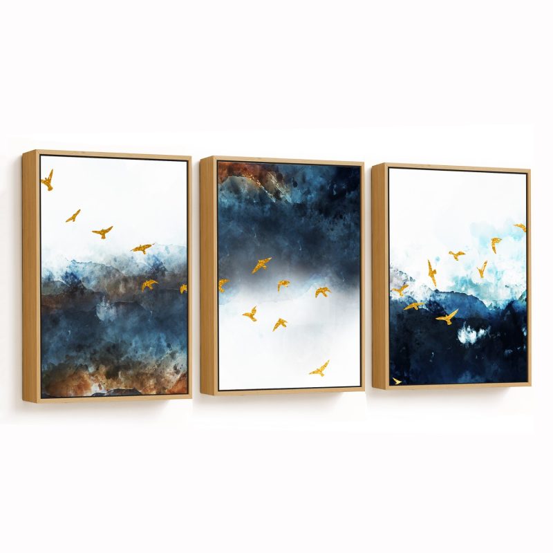Set of 3 golden mecurial birds in the sky